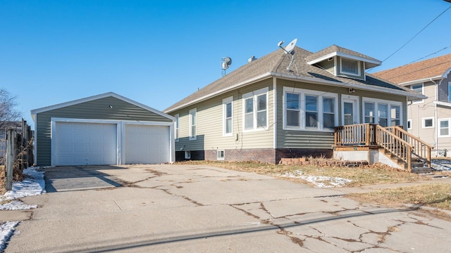 view of front of house with an outbuilding and a garage