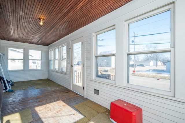 unfurnished sunroom featuring wooden ceiling