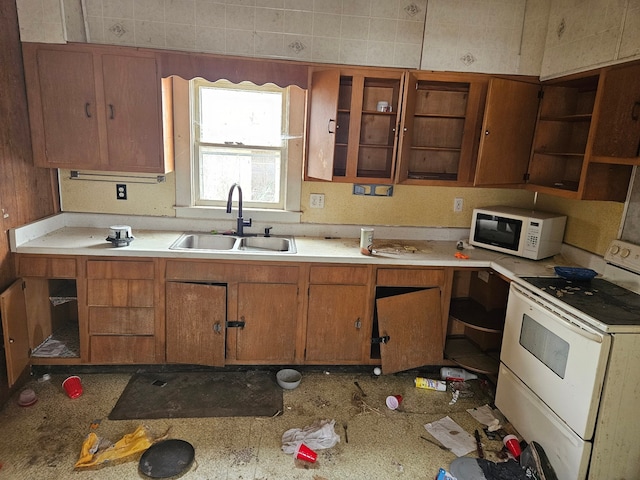 kitchen featuring white appliances and sink