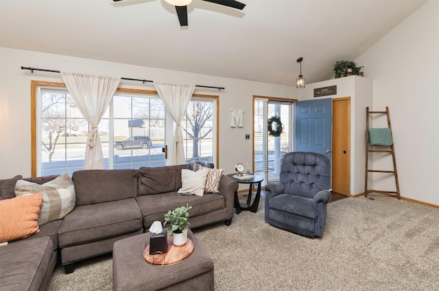 living room featuring lofted ceiling, carpet floors, ceiling fan, and plenty of natural light