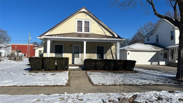 view of front facade featuring a porch and a garage