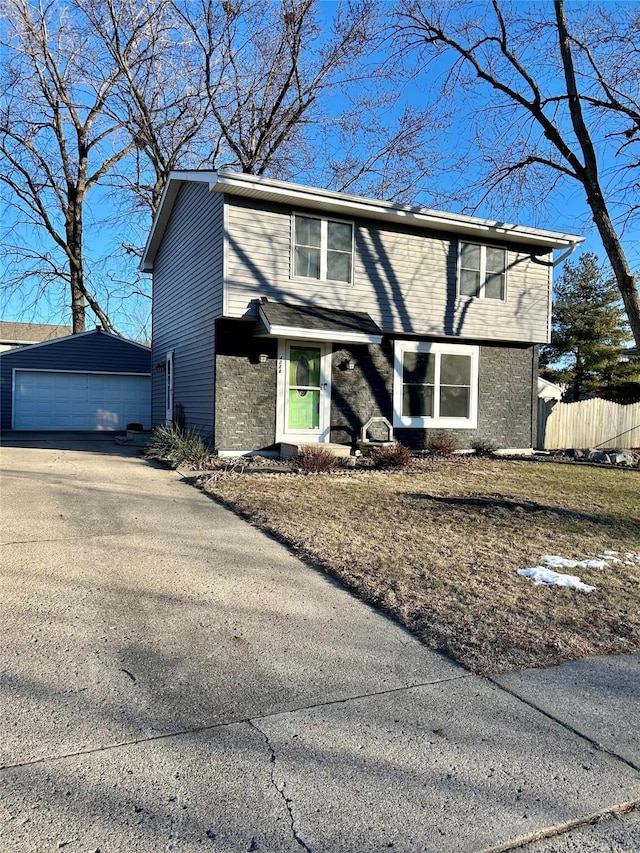 view of front of home featuring a garage and an outdoor structure