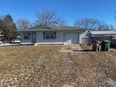 single story home with a garage