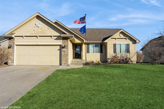 view of front of home with a front lawn and a garage