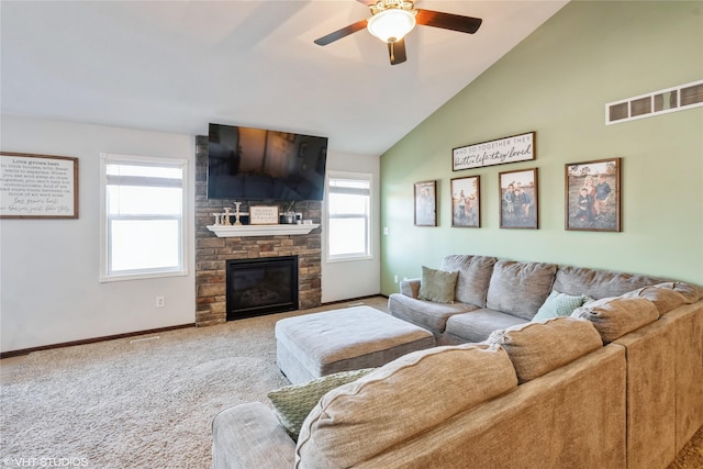 carpeted living room featuring ceiling fan, lofted ceiling, and a fireplace