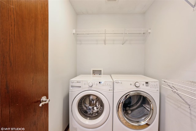 washroom featuring independent washer and dryer