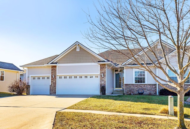 view of front of home featuring a garage and a front lawn