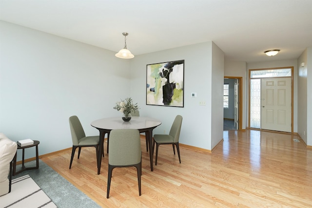 dining room with light hardwood / wood-style floors