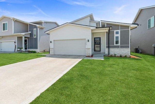 view of front of property with a garage and a front yard