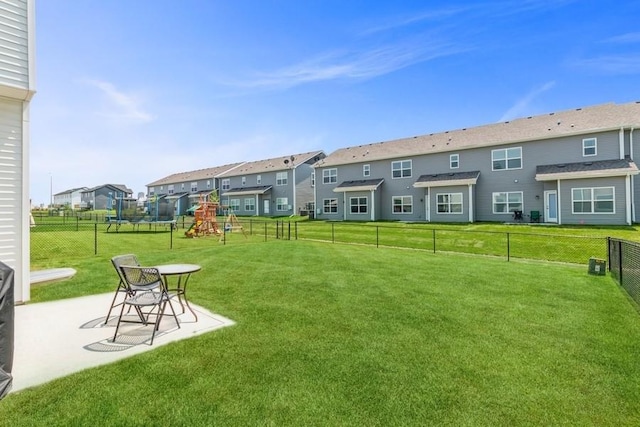 view of yard with a playground and a patio area