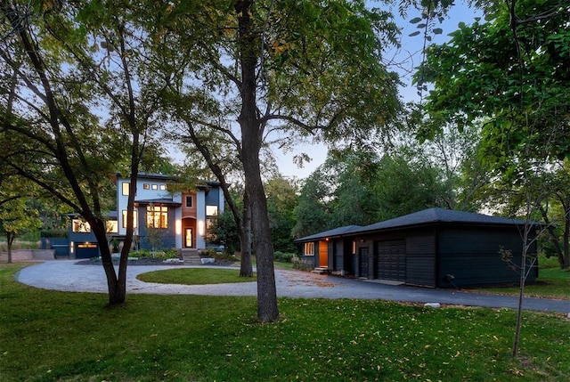 view of front facade with a garage and a front yard