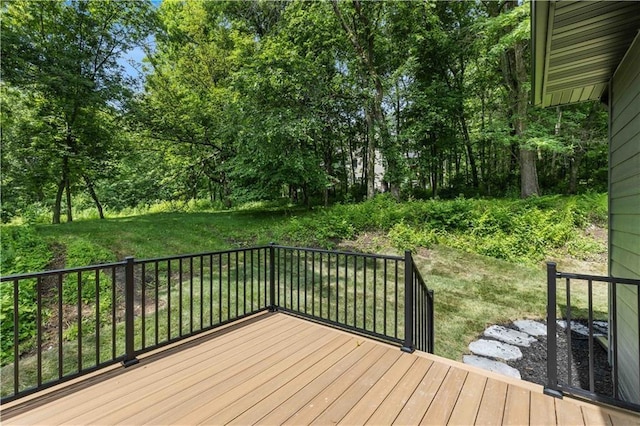 wooden terrace with a yard