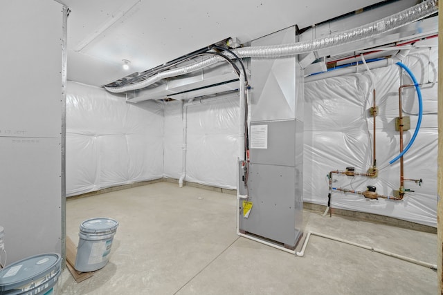 basement featuring heating unit