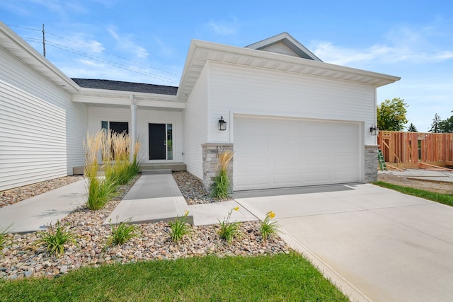 single story home featuring a garage