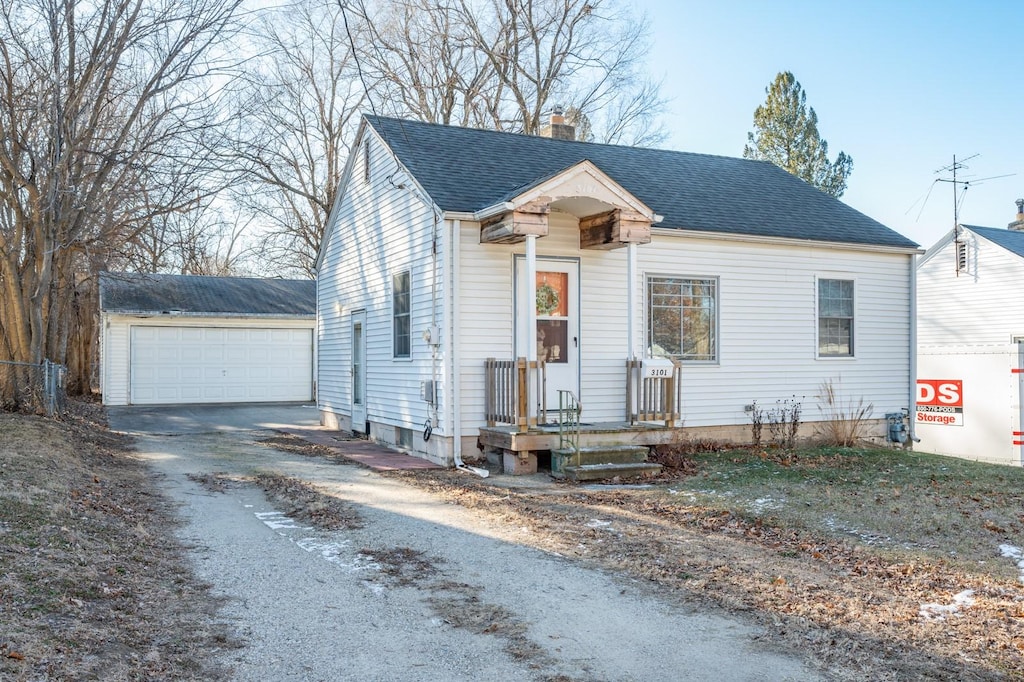 view of front of house with an outdoor structure and a garage