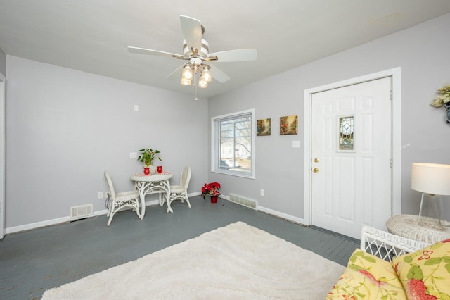 interior space with ceiling fan