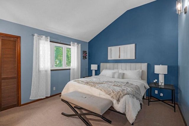 bedroom featuring carpet flooring and vaulted ceiling