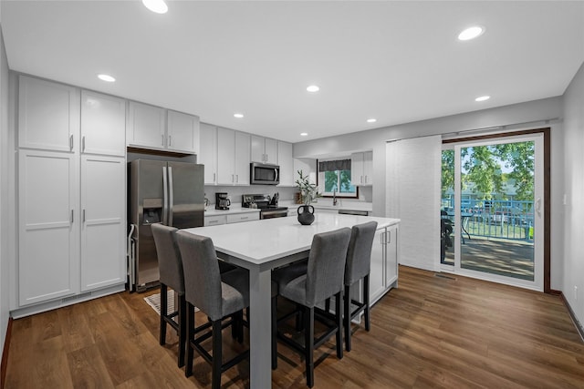 dining space featuring dark wood-type flooring