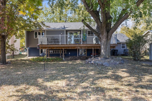 rear view of house featuring a deck