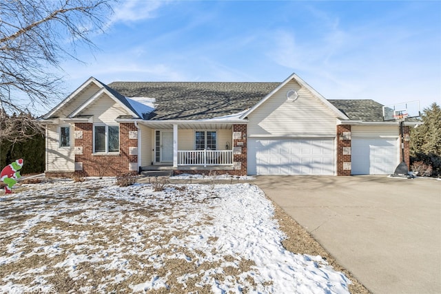 single story home with covered porch and a garage