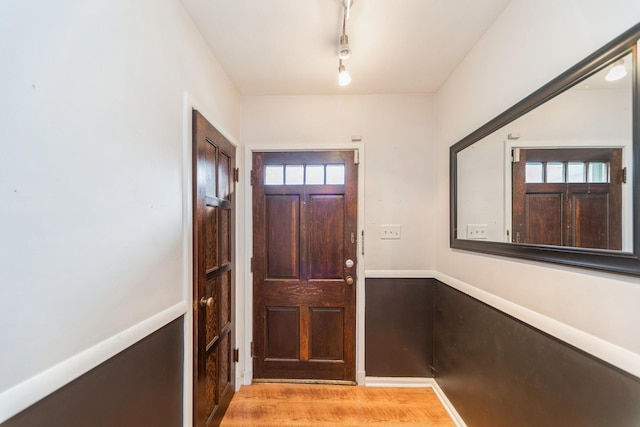 entryway featuring light hardwood / wood-style floors and track lighting