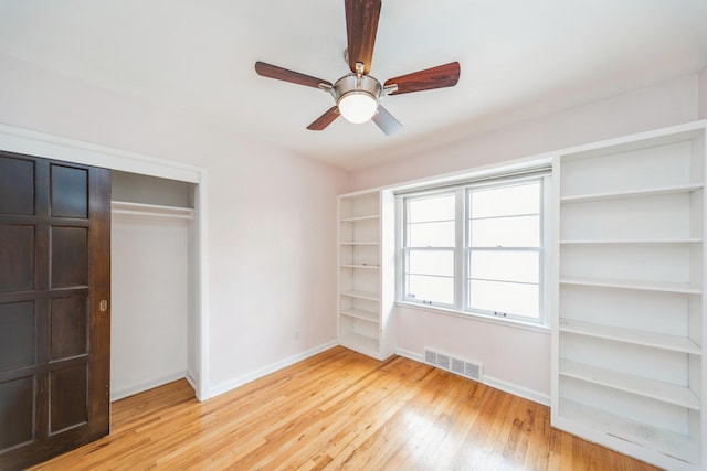 unfurnished bedroom with a closet, ceiling fan, and light hardwood / wood-style flooring