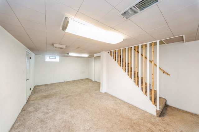 basement with light colored carpet