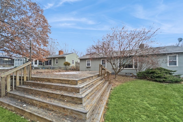 back of house featuring a yard