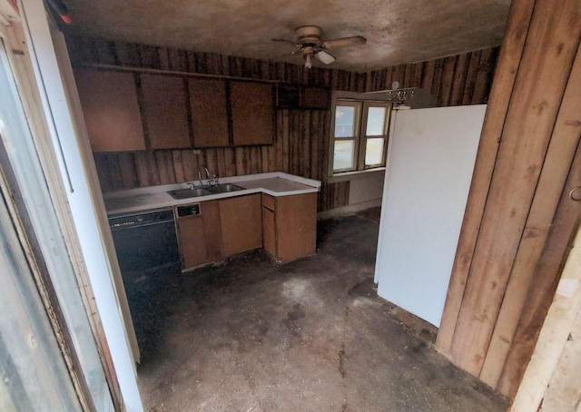 kitchen featuring sink, white refrigerator, black dishwasher, and ceiling fan