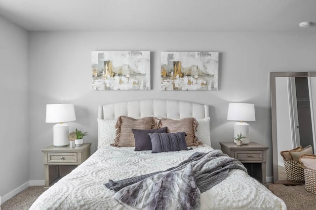 bedroom featuring baseboards and carpet flooring