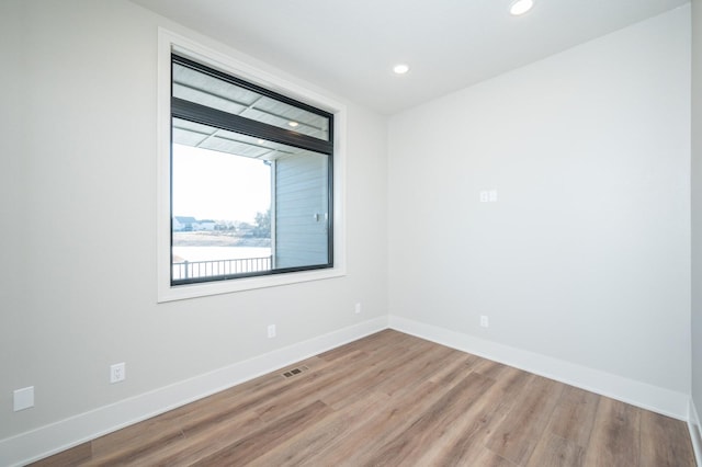 spare room featuring light wood-type flooring