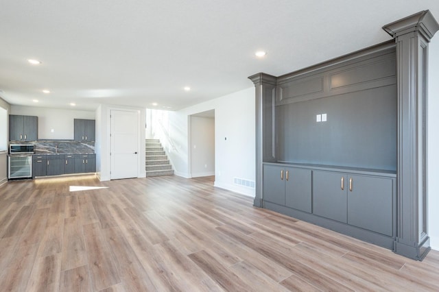 unfurnished living room featuring light hardwood / wood-style flooring