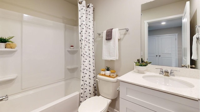 bathroom featuring toilet, shower / tub combo, and vanity