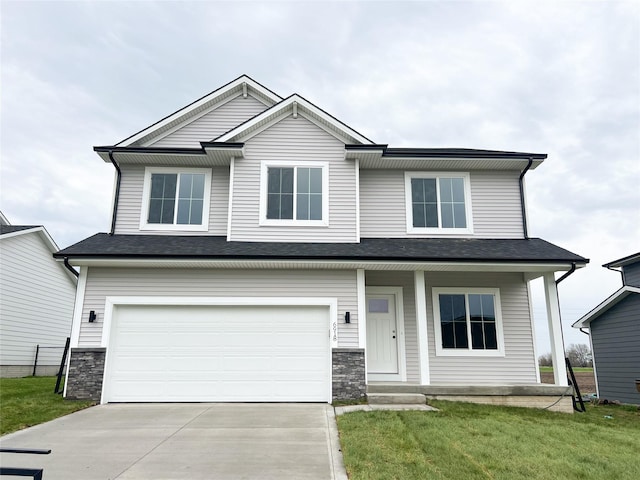 6918 SE 7th Ave, Pleasant Hill, IA 50327 - craftsman-style house with covered porch, a garage, driveway, stone siding, and a front lawn