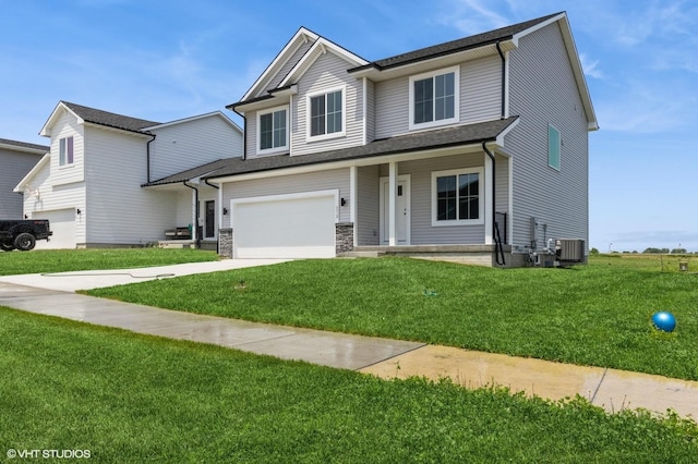 6918 SE 7th Ave, Pleasant Hill, IA 50327 - view of front facade with an attached garage, driveway, a front lawn, and a porch