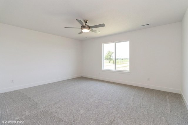 6918 SE 7th Ave, Pleasant Hill, IA 50327 - spare room with ceiling fan and light carpet