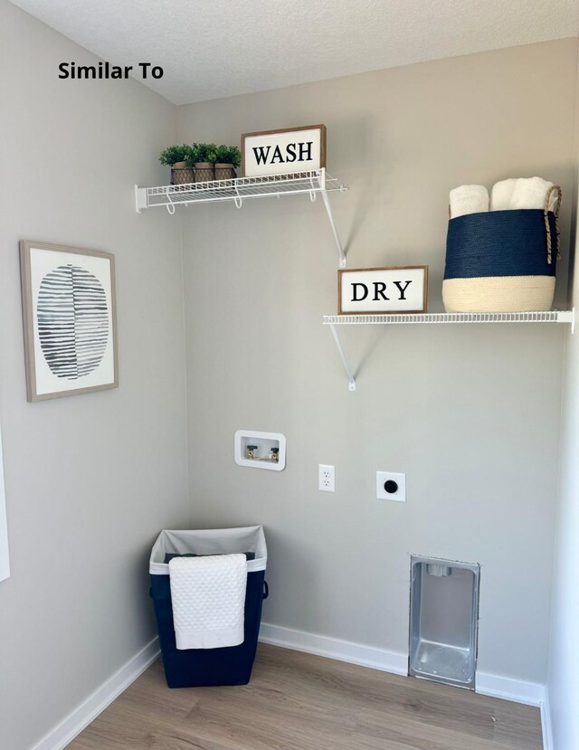 625 W Wright Rd, Norwalk, IA 50211 - washroom featuring hookup for a washing machine, electric dryer hookup, wood finished floors, and baseboards
