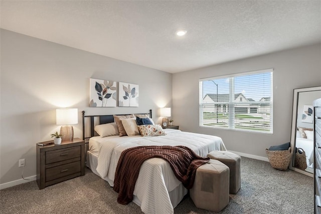 bedroom featuring baseboards, a textured ceiling, and carpet flooring