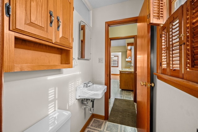 bathroom with toilet and sink