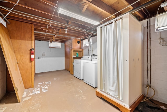 basement featuring washer and clothes dryer