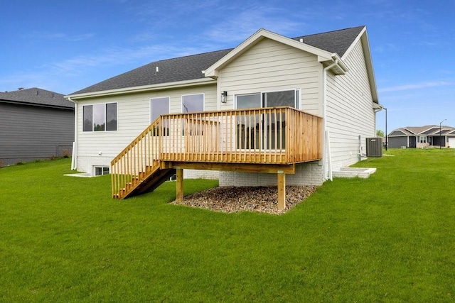 back of house featuring central AC, a yard, and a deck