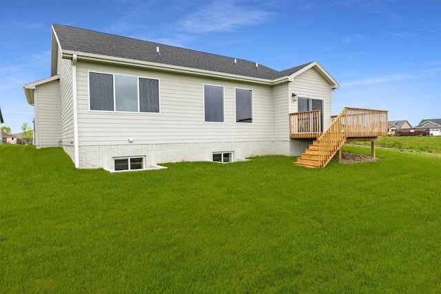 back of house with a yard and a wooden deck