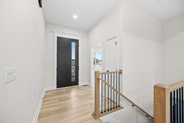 entrance foyer featuring recessed lighting, light wood-style flooring, and baseboards