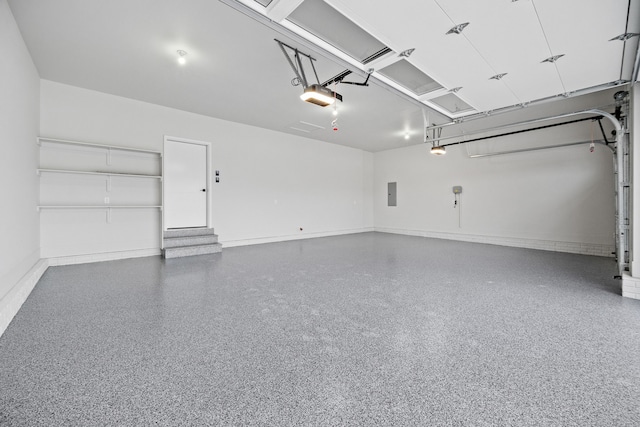 18007 Hammontree Cir, Clive, IA 50325 - garage with electric panel, baseboards, and a garage door opener