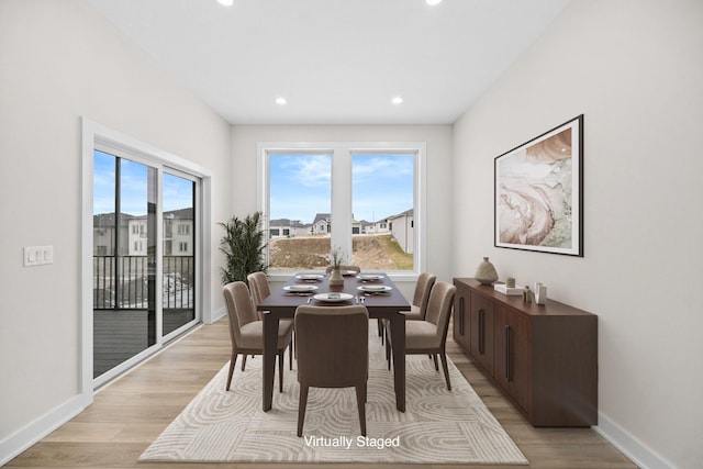 dining area featuring a wealth of natural light, light wood-style flooring, baseboards, and recessed lighting