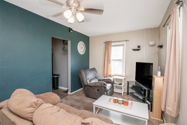 living room with ceiling fan and carpet floors