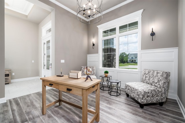 office with hardwood / wood-style floors, an inviting chandelier, and ornamental molding