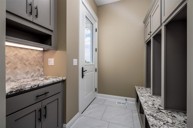 mudroom featuring light tile patterned flooring