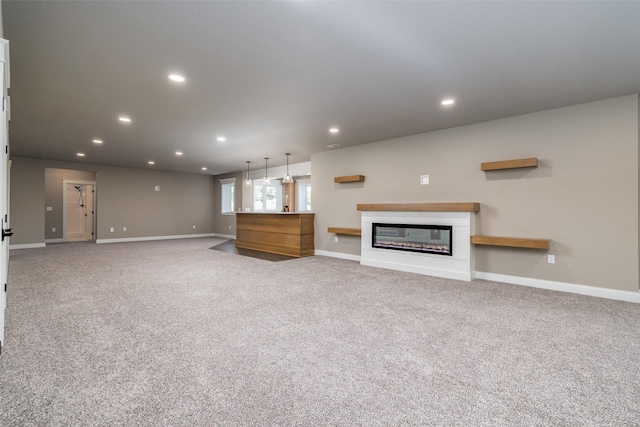 unfurnished living room with light colored carpet