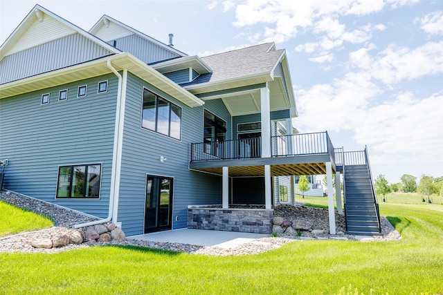 back of property featuring a patio and a yard